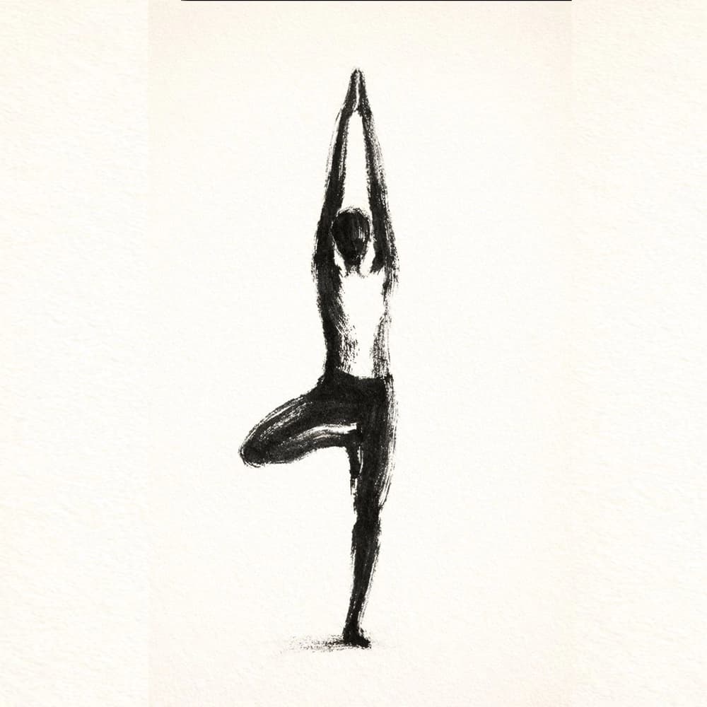 Person practicing peaceful yoga in a sunlit studio